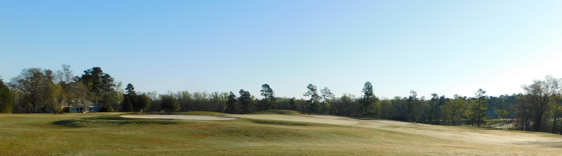 Golf course with trees in the background 